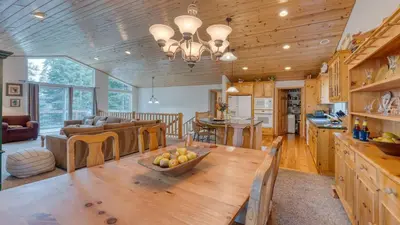 a kitchen and living room with a table and a couch at Tahoe Vista by AvantStay Central Location Patio in Tahoe Vista
