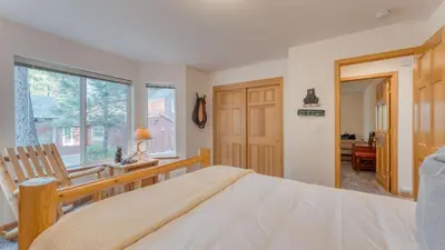 a bedroom with a bed and a desk and a window at Tahoe Vista by AvantStay Central Location Patio in Tahoe Vista