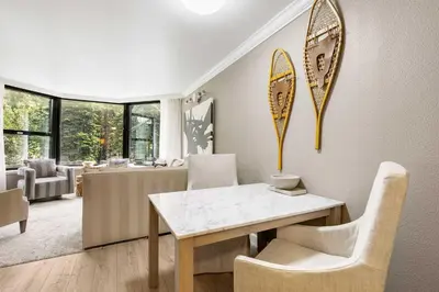 a dining room with a table and chairs at Everline Resort and Spa 1BR Suite with Fireplace in Olympic Valley