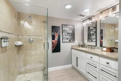 a bathroom with a shower and a glass shower stall at Everline Resort and Spa 1BR Suite with Fireplace in Olympic Valley