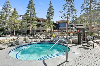 a swimming pool in front of a building at Everline Resort and Spa 1BR Suite with Fireplace in Olympic Valley
