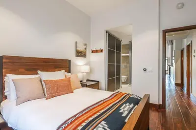 a bedroom with a large bed with a wooden headboard at Snowcreek V 731 in Mammoth Lakes