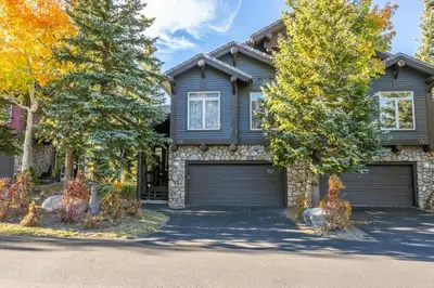 a house with two garage doors in a driveway at Snowcreek V 731 in Mammoth Lakes