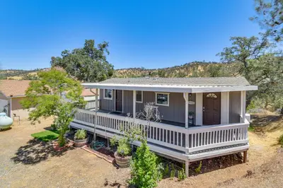 an image of a house with a porch at La Grange Home with Covered Patio and Gas Grill! in La Grange
