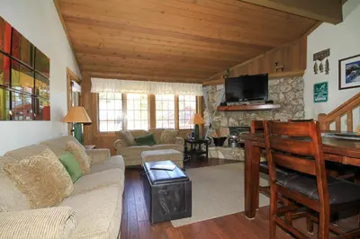 a living room with a couch and a tv at Mountainback 68 2 bedroom with loft in Mammoth Lakes