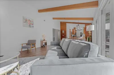 a living room with a gray couch and a table at Modern 3BR Carnelian Bay Retreat in Carnelian Bay