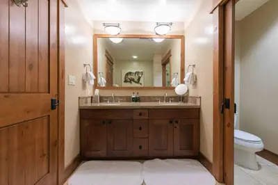 a bathroom with a sink and a mirror and a toilet at Big Horn Lodge 206 by East West in Truckee