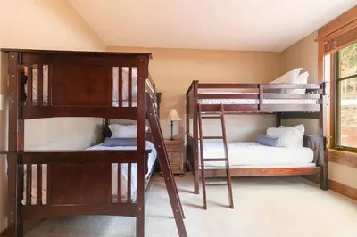 a room with two bunk beds and a bed at Big Horn Lodge 206 by East West in Truckee