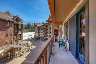 an outdoor balcony with a view of a resort at Big Horn Lodge 301 by East West Hospitality in Truckee
