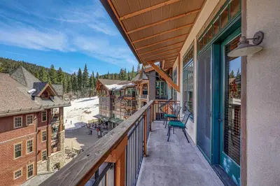 a balcony of a lodge with a view of the snow at Big Horn Lodge 501 by East West Hospitality in Truckee