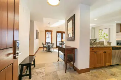 a kitchen with a desk and a dining room at Big Horn Lodge 410 by East West Hospitality in Truckee