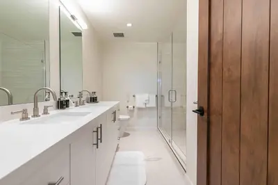 a bathroom with two sinks and a shower at Boulders 15136 by East West Hospitality in Truckee