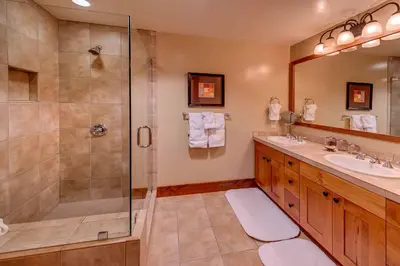 a bathroom with a shower and a sink at Catamount Lodge 206A by East West Hospitality in Truckee