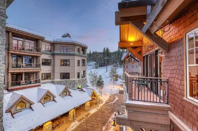 an aerial view of a building with snow covered roofs at Catamount Lodge 409 by East West Hospitality in Truckee