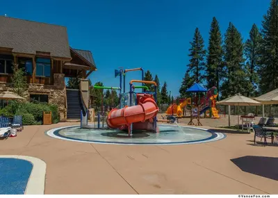 a water park with a slide and a playground at Fairway Drive 13113 by East West Hospitality in Truckee