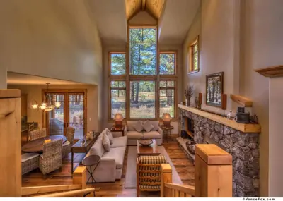 a living room with a couch and a fireplace at Fairway Drive 13136 by East West Hospitality in Truckee