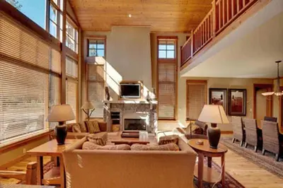a living room with a couch and a fireplace at Gold Rush Trail 12560 by East West Hospitality in Truckee