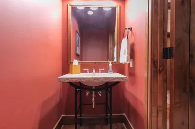 a bathroom with a sink and a mirror at Great Bear Lodge 504 by East West Hospitality in Truckee