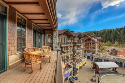 a balcony of a lodge with a view of the mountains at Great Bear Lodge 504 by East West Hospitality in Truckee