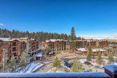 arial view of a resort in the winter with snow at Iron Horse Lodge South 502 by East West Hospitality in Truckee