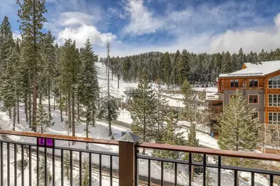 a view from a balcony of a resort in the snow at Iron Horse Lodge South 404 by East West Hospitality in Truckee