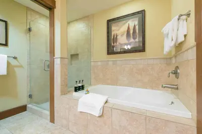 a large bathroom with a tub and a shower at Iron Horse Lodge North 201 by East West Hospitality in Truckee