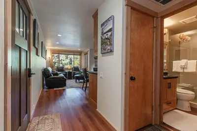 a hallway of a home with a living room at Ski Trails 4119 by East West Hospitality in Truckee