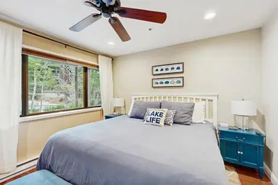 a bedroom with a bed and a ceiling fan at Knotty & Nice in Incline Village
