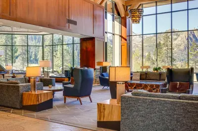 a lobby with couches and chairs and large windows at Pool and Hot Tub Access! Condo in Olympic Valley in Olympic Valley