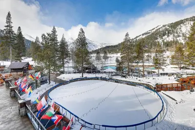 a ski resort with a snow covered ice rink at Ski-InandSki-Out and Resort Perks Olympic Valley Gem in Olympic Valley