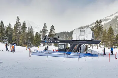 a ski lift with a house on it in the snow at Ski-InandSki-Out and Resort Perks Olympic Valley Gem in Olympic Valley