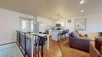 a kitchen and living room with a table and chairs at Lakeview Villas #24 condo in Mammoth Lakes