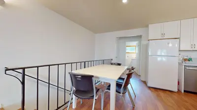 a kitchen with a table and chairs and a refrigerator at Lakeview Villas #24 condo in Mammoth Lakes