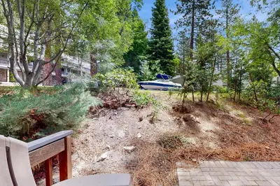 a house with a boat parked in a yard at The Great Escape in Incline Village