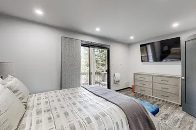 a bedroom with a large bed and a window at Modern Mountain Retreat in Incline Village