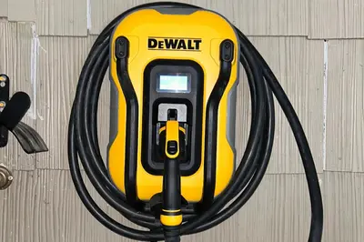 a yellow deathmatch hose is hooked up to a wall at Modern Mountain Retreat in Incline Village