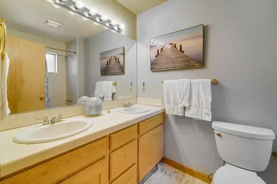 a bathroom with a sink and a toilet and a mirror at Close to Ski Slopes Tahoe Ski Chalet with Fireplace in Tahoe City