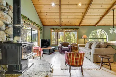 a living room with a fireplace and a couch at Close to Ski Slopes Tahoe Ski Chalet with Fireplace in Tahoe City