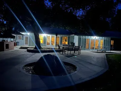 a night view of a house with lights on a patio at Private Country Home Near Downtown - Sonora in Sonora