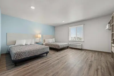 a bedroom with two beds and a window at WoodSpring Suites Ceres - Modesto in Ceres