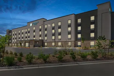 an rendering of the hotel front of the building at WoodSpring Suites Ceres - Modesto in Ceres
