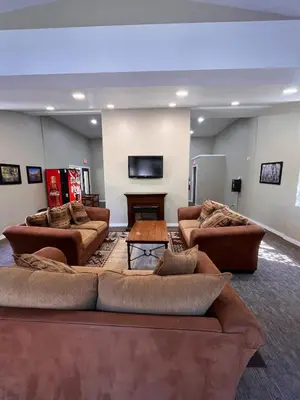 a large living room with couches and a table at Walk-to-Lifts Condo with Hot Tub, Dog Friendly in Mammoth Lakes