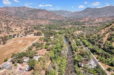 an aerial view of a valley with mountains at The River House in Three Rivers