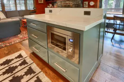 a kitchen with a counter with an oven at 45 The Overlook in Wawona