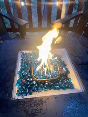 a cake with a fire in the middle of it at Cozy Chalet - Hot Tub with Meadow Views - Family & Pets, Fire Pit & BBQ in Arnold