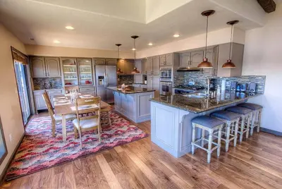 a kitchen with a table and a dining room at Epiphany home in South Lake Tahoe