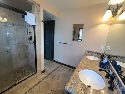 a bathroom with two sinks and a shower at Epiphany home in South Lake Tahoe
