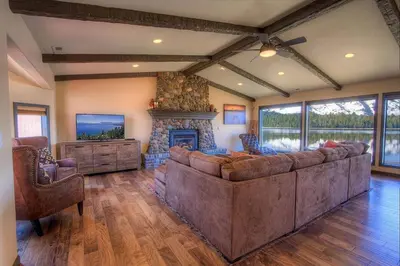 a living room with a large couch and a fireplace at Epiphany home in South Lake Tahoe