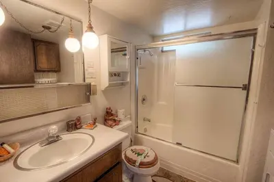 a bathroom with a sink and a shower at Bambi's Bunkhouse home in South Lake Tahoe