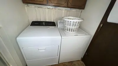 a small white refrigerator with a blender on top of it at Bambi's Bunkhouse home in South Lake Tahoe